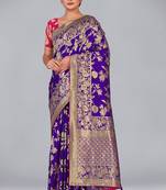 Glamour and tradition with this zari woven violet color banarasi satin silk blend saree
