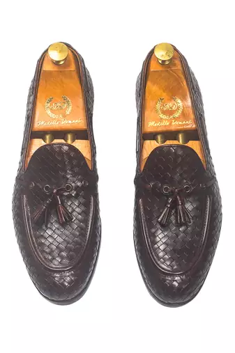 Woven leather tassel slipons