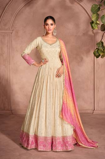 cream embroidered jacquard  free size stitched gown.(size up to 42")