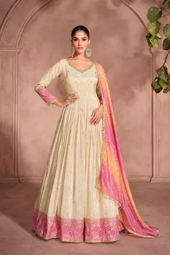cream embroidered jacquard  free size stitched gown.(size up to 42")