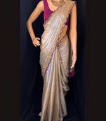 Cream soft tissue with lace embroidered and tassels saree with unstitched blouse