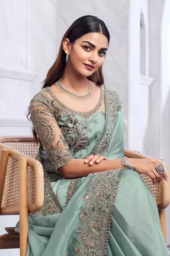 sea green silk blend beautiful embellished saree with embroidered blouse