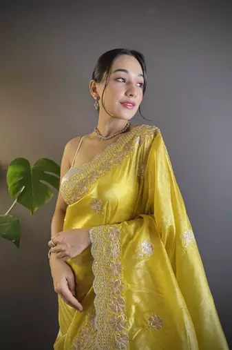 Yellow gold crunchy saree with sequins embroidery and cut work