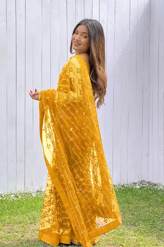 Yellow graceful butterfly net sequins embroidery saree with diamond work