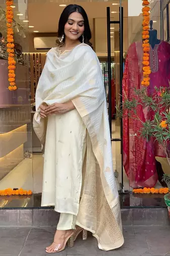 Off white colour viscosee chanderi fabric partywear ready suit with embroidery work