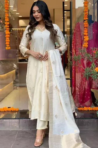 Off white colour viscosee chanderi fabric partywear ready suit with embroidery work