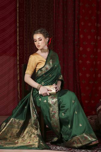 Dark green paithani silk blend woven design saree
