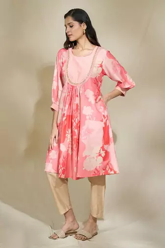 Peach pintexed tunic with pearl cutdana work beige pants