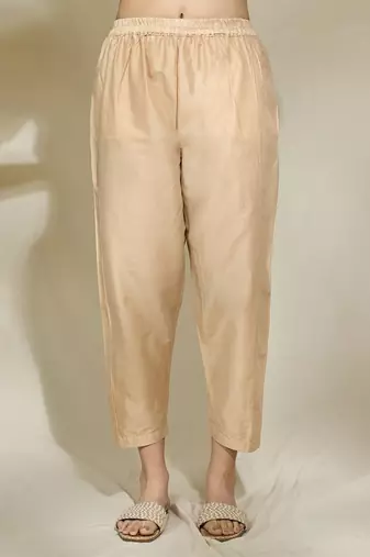 Peach pintexed tunic with pearl cutdana work beige pants