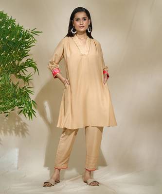 Beige red pink tunic set - tagai work highlighted zari sequence work on pants sleeves & back 1