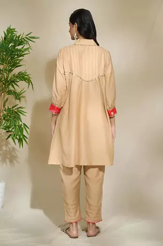 Beige red pink tunic set - tagai work highlighted zari sequence work on pants sleeves & back