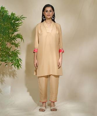 Beige red pink tunic set - tagai work highlighted zari sequence work on pants sleeves & back 4