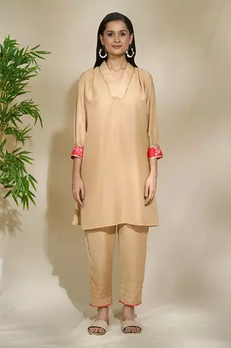 Beige red pink tunic set - tagai work highlighted zari sequence work on pants sleeves & back