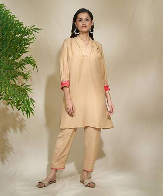 Beige red pink tunic set - tagai work highlighted zari sequence work on pants sleeves & back 5