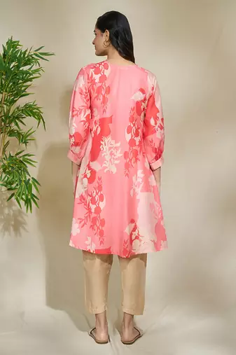 Peach pintexed tunic with pearl cutdana work beige pants
