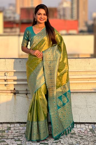 Green zari woven tissue silk saree with unstitched blouse piece