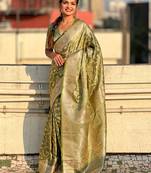 Green zari woven Banarasi silk blend saree with unstitched blouse piece