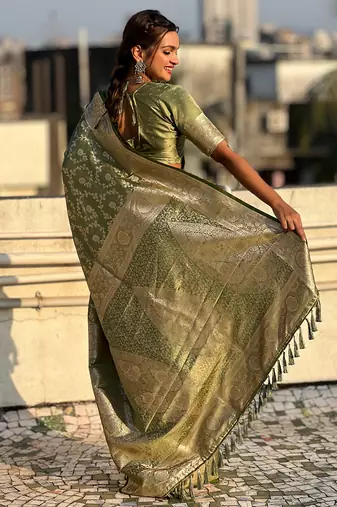 Green zari woven Banarasi silk blend saree with unstitched blouse piece