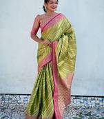 Green zari woven tissue silk saree with unstitched blouse piece