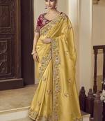 Party wear yellow fancy fabric saree with silk blouse