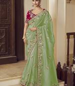 Party wear green fancy fabric saree with silk blouse