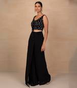 Black top and wrap pants