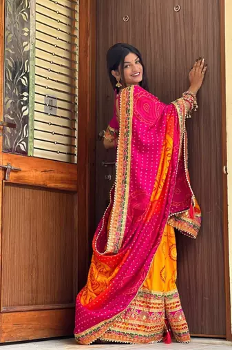 Pink bandhani print silk saree  with lace border and unstitched blouse piece