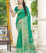 Sangam prints teal green silk woven work festival saree