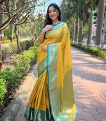 Yellow zari woven tissue silk women's saree with blouse piece