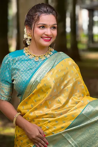 Yellow kanchipuram tissue silk saree with unstitched blouse piece