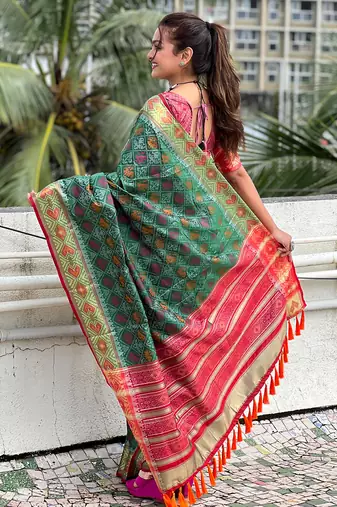 Green patola silk saree with unstitched blouse piece