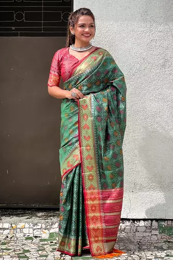 Green patola silk saree with unstitched blouse piece
