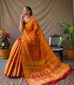 Orange pure patola silk saree and unstitched blouse piece