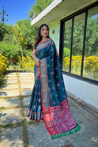 Teal patola silk saree and has a  zari border blouse piece
