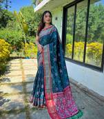 Teal patola silk saree and has a  zari border blouse piece