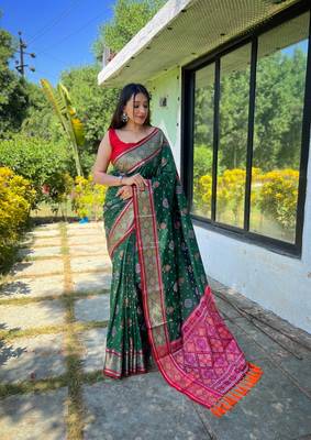 Green patola silk saree and has a  zari border blouse piece 1