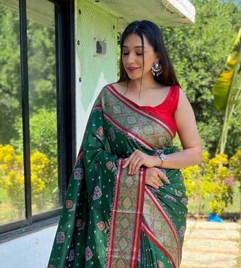 Green patola silk saree and has a  zari border blouse piece 3