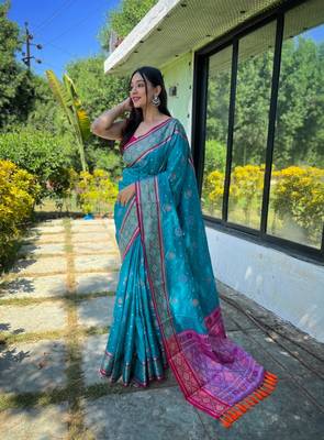 Blue patola silk saree and has a  zari border blouse piece 1