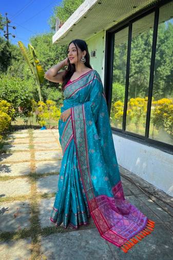 Blue patola silk saree and has a  zari border blouse piece