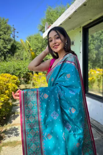 Blue patola silk saree and has a  zari border blouse piece
