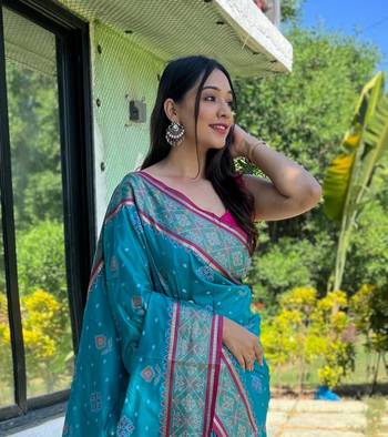 Blue patola silk saree and has a  zari border blouse piece 3