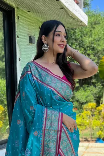 Blue patola silk saree and has a  zari border blouse piece