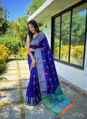 Royal blue patola silk saree and has a  zari border blouse piece 1