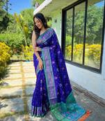 Royal blue patola silk saree and has a  zari border blouse piece