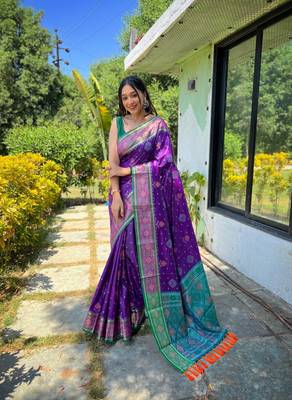 Purple patola silk saree and has a  zari border blouse piece 1