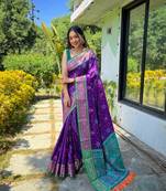 Purple patola silk saree and has a  zari border blouse piece