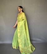 Light green tissue silk saree with unstitched blouse piece