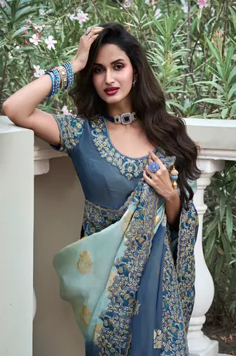 Sky blue pure tissue silk heavy thread embroidery work on border with zari weaving saree with blouse