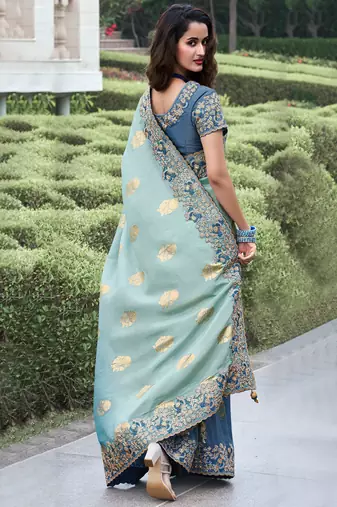 Sky blue pure tissue silk heavy thread embroidery work on border with zari weaving saree with blouse