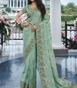Sea green pure tissue silk heavy thread embroidery work on border with zari weaving saree with blouse